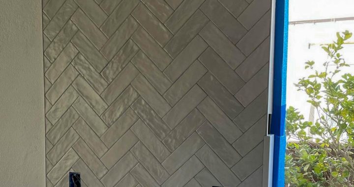 A kitchen remodeling project with installed tiles as kitchen backsplash