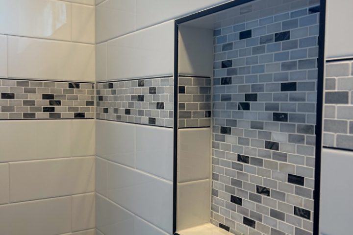 Recessed shower niche on a tile shower backsplash